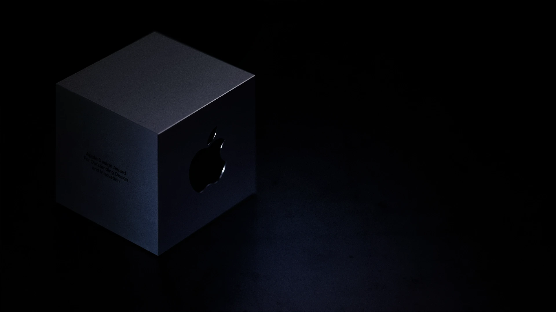 Apple Design Award with purple light and dark background