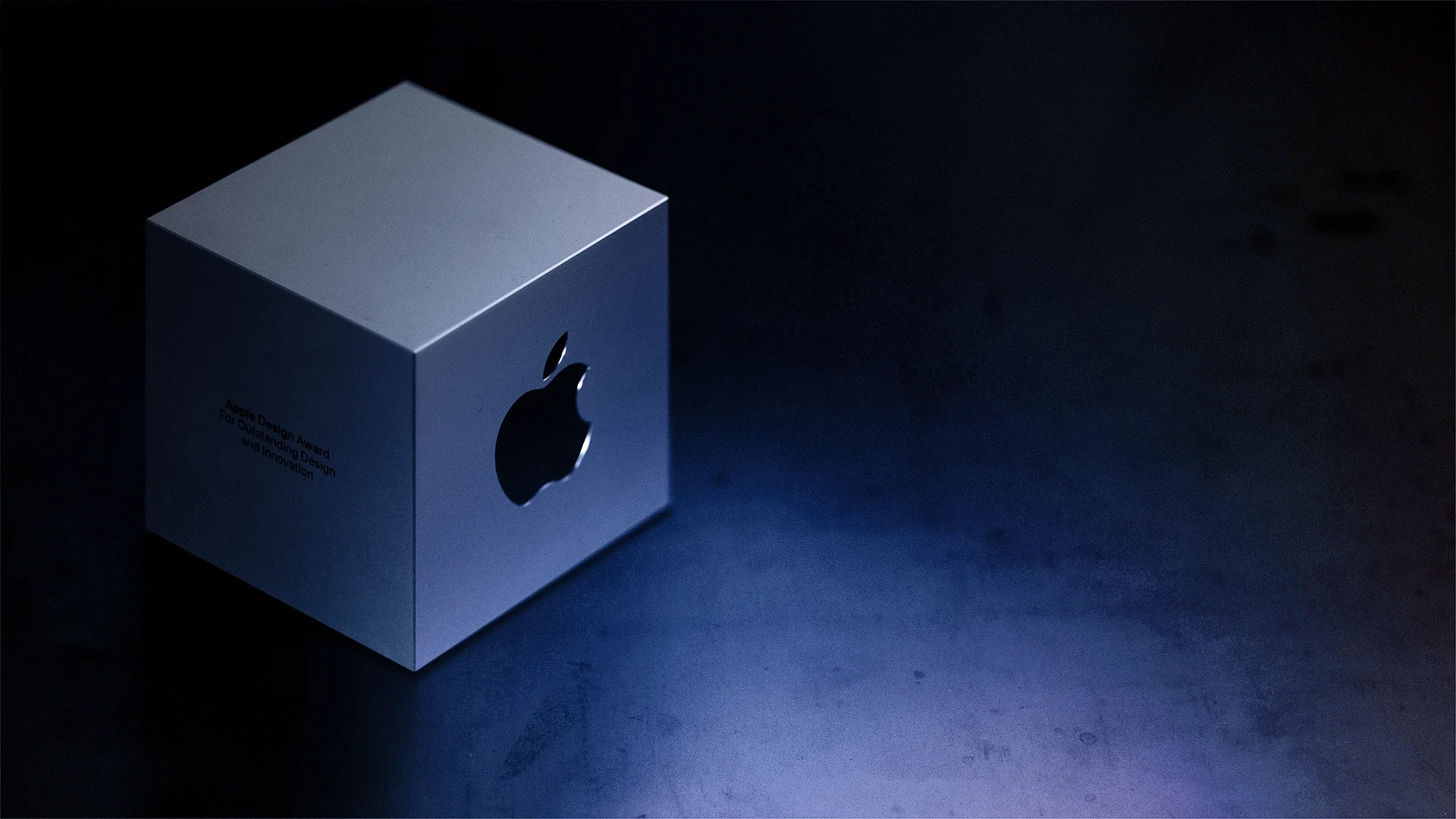 Apple Design Award with purple light and dark background